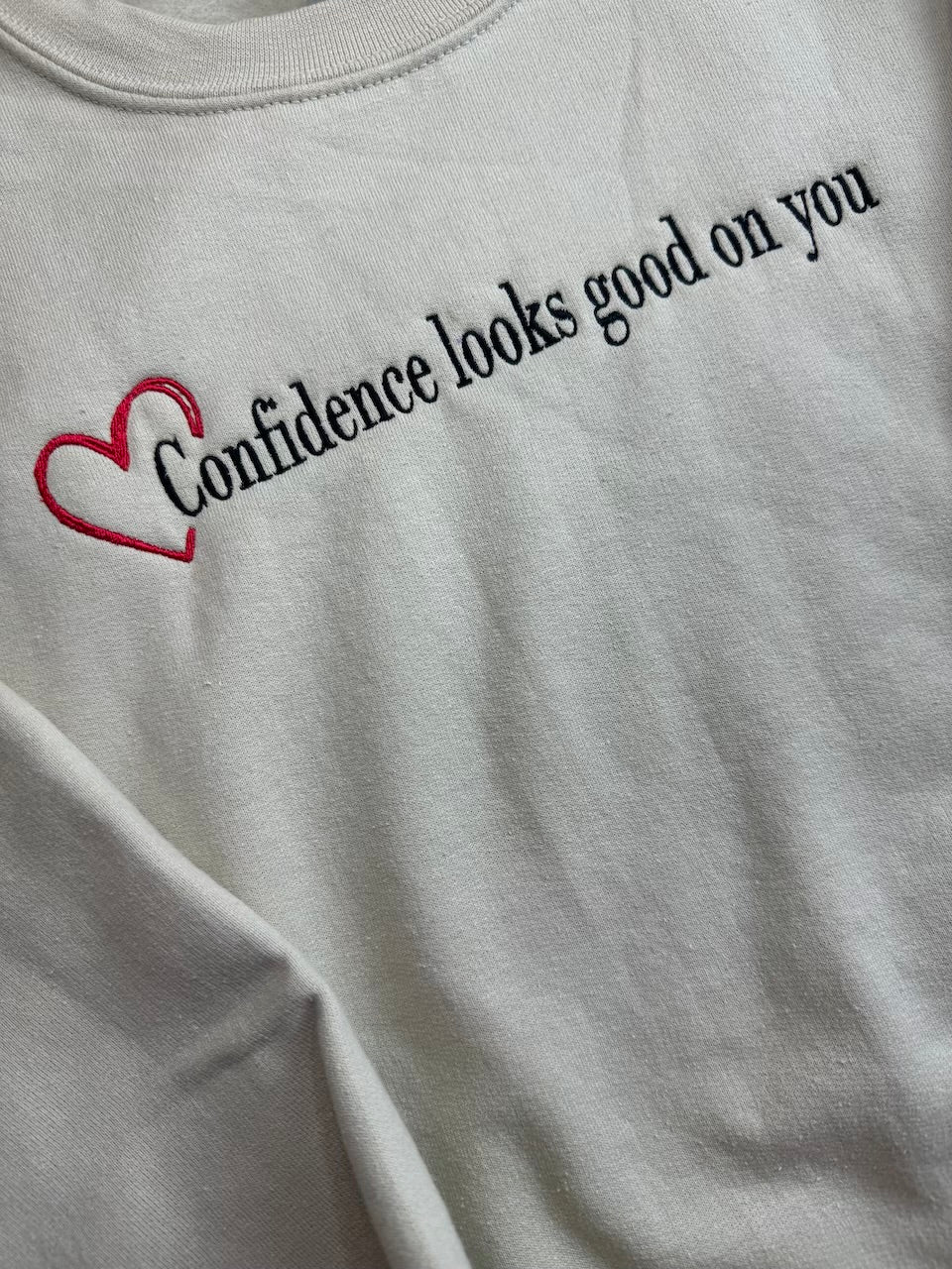 Confidence looks good on you crewneck with heart