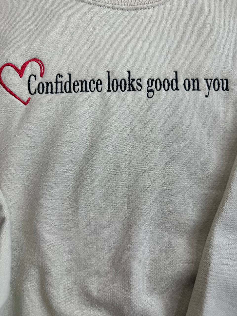 Confidence looks good on you crewneck with heart